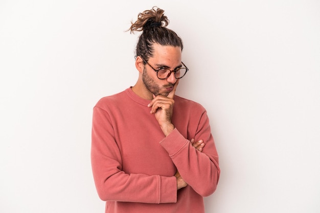 Young caucasian man isolated on white background contemplating, planning a strategy, thinking about the way of a business.