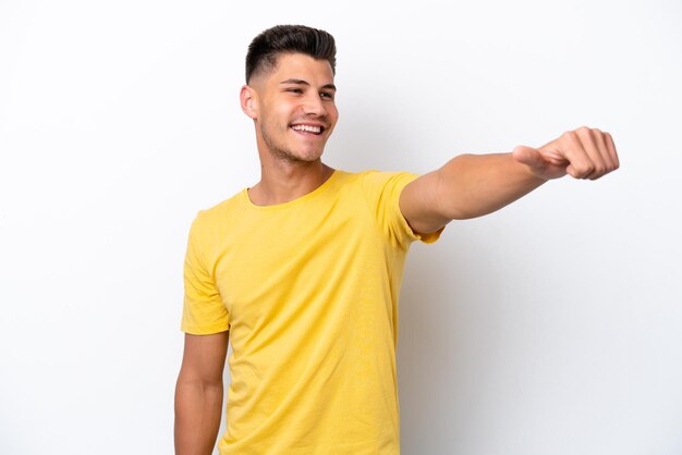 Young caucasian man isolated on white background giving a thumbs up gesture