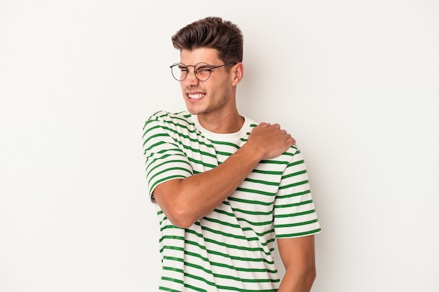 Young caucasian man isolated on white background having a shoulder pain.