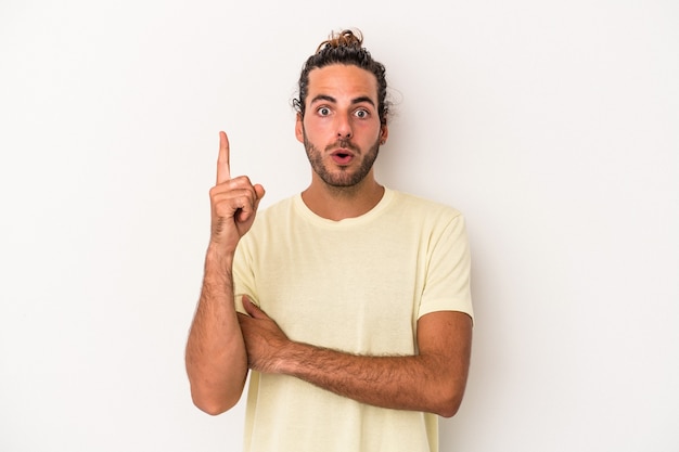 Young caucasian man isolated on white background having some great idea, concept of creativity.