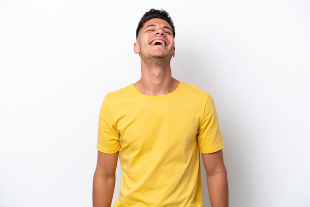 Young caucasian man isolated on white background laughing