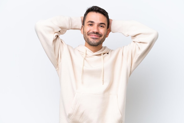 Young caucasian man isolated on white background laughing