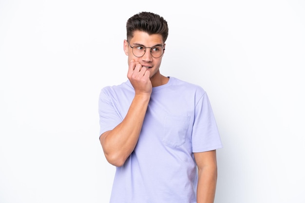 Young caucasian man isolated on white background nervous and scared