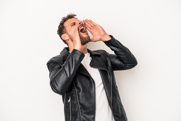 Young caucasian man isolated on white background shouting excited to front.