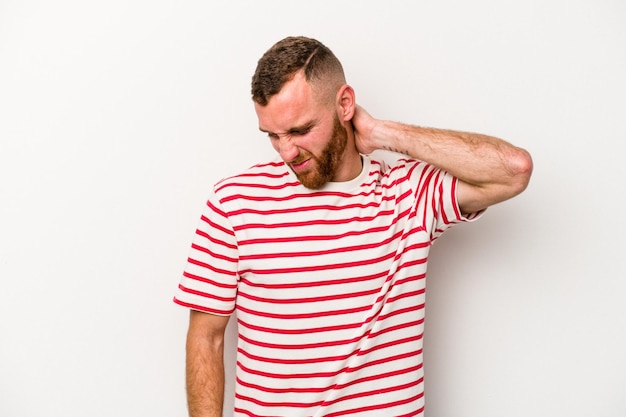 Young caucasian man isolated on white background suffering neck pain due to sedentary lifestyle.