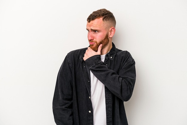 Young caucasian man isolated on white background suffers pain in throat due a virus or infection.