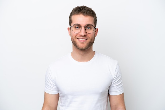 Young caucasian man isolated on white background With glasses with happy expression