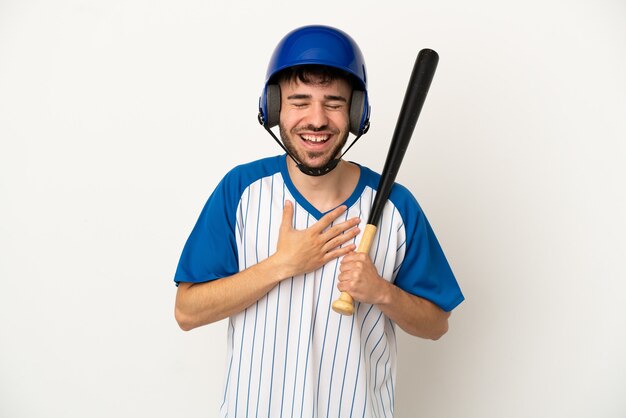 写真 たくさん笑って白い背景で隔離の野球をしている若い白人男性
