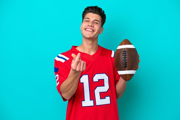 Young caucasian man playing rugby isolated on blue background
making money gesture