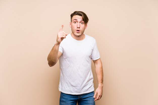 Young caucasian man posing isolated having an idea, inspiration concept.