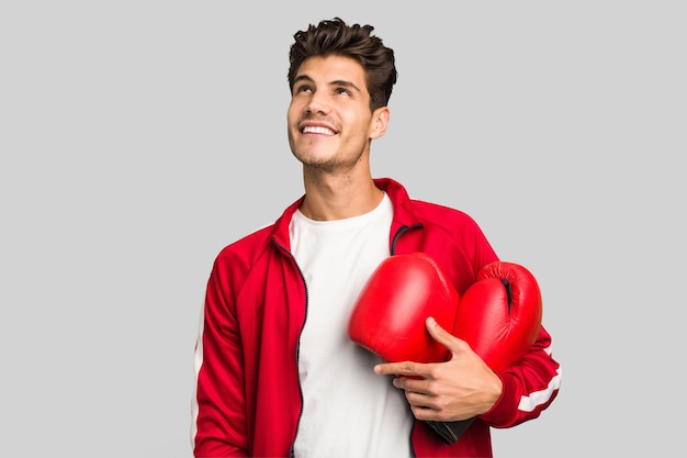 Young caucasian man practicing boxeo isolated