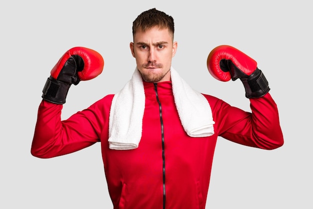 Young caucasian man practicing boxing cut out isolated