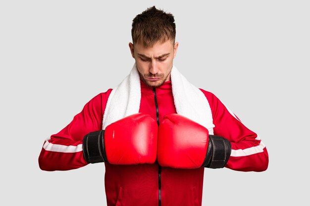 Young caucasian man practicing boxing cut out isolated