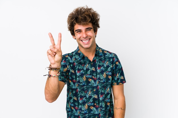 Young caucasian man wearing a flower t-shirt isolated showing number two with fingers.