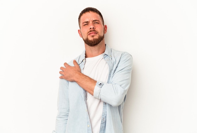 Young caucasian man with diastema isolated on white background having a shoulder pain.