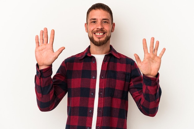 Photo young caucasian man with diastema isolated on white background showing number ten with hands.