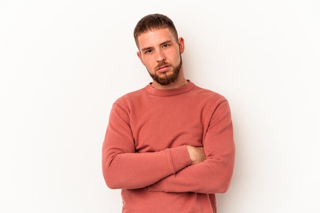 Young caucasian man with diastema isolated on white background who is bored, fatigued and need a relax day.