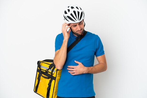 Young caucasian man with thermal backpack isolated on white background with headache