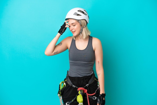 Young caucasian rock-climber woman isolated on white background laughing