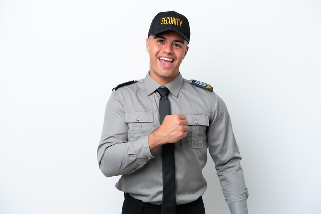 Young caucasian security man isolated on white background celebrating a victory