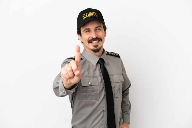 Young caucasian security man isolated on white background showing and lifting a finger