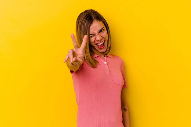 Young caucasian skinny woman showing number two with fingers