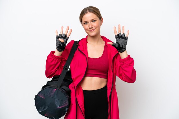 Young caucasian sport woman isolated on white background counting nine with fingers