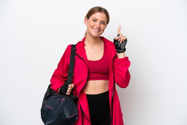 Young caucasian sport woman isolated on white background showing and lifting a finger in sign of the best