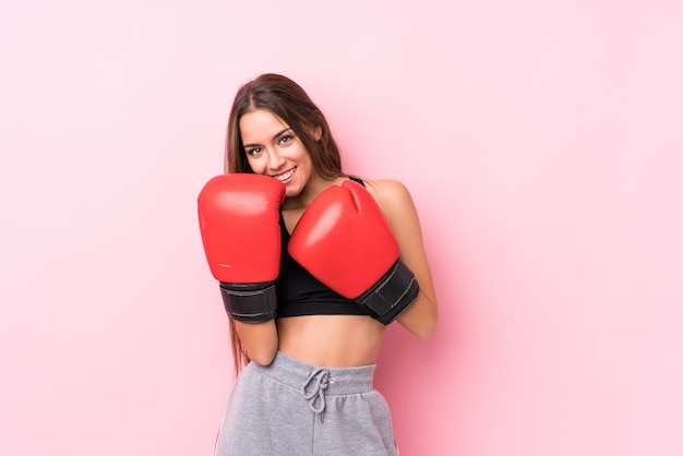 Young caucasian sporty woman boxing