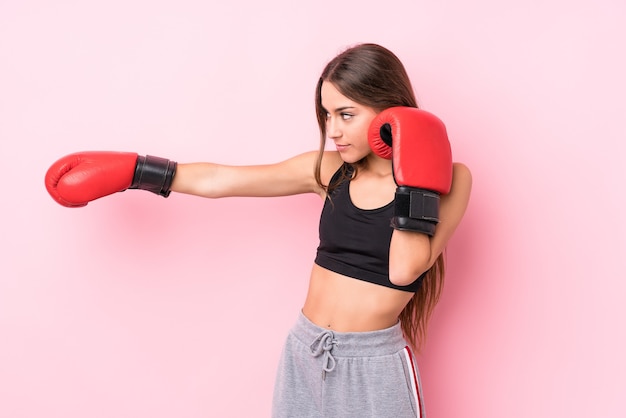 Young caucasian sporty woman boxing