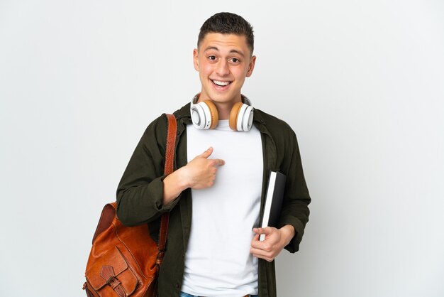 Young caucasian student man isolated on white wall with surprise facial expression