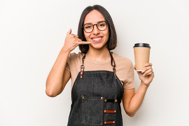 Young caucasian waitress woman holding take away coffee isolated on white background showing a mobile phone call gesture with fingers