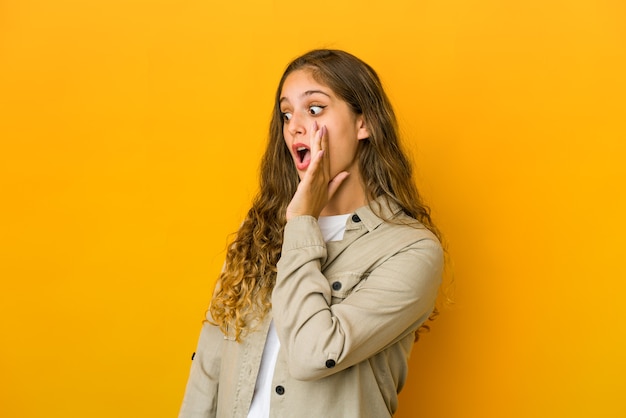 Young caucasian woman being shocked because of something