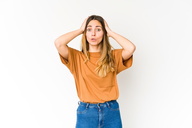 Young caucasian woman being shocked, she has remembered important meeting.