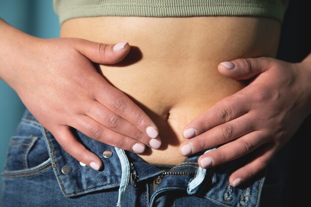 Young caucasian woman belly Health