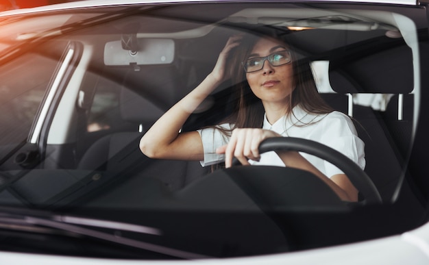 young caucasian woman in a car