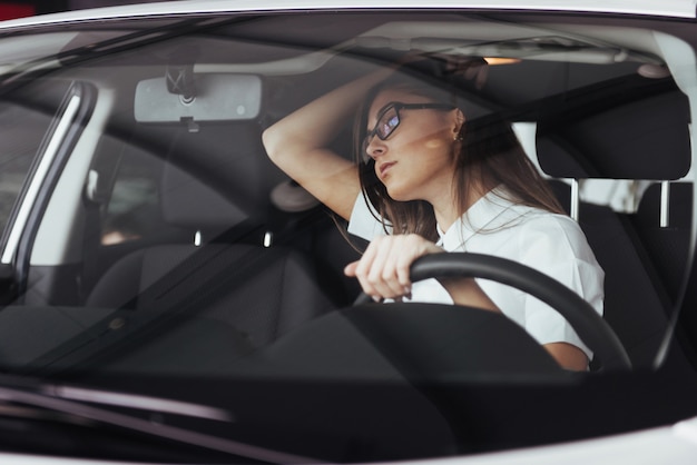 young caucasian woman in a car