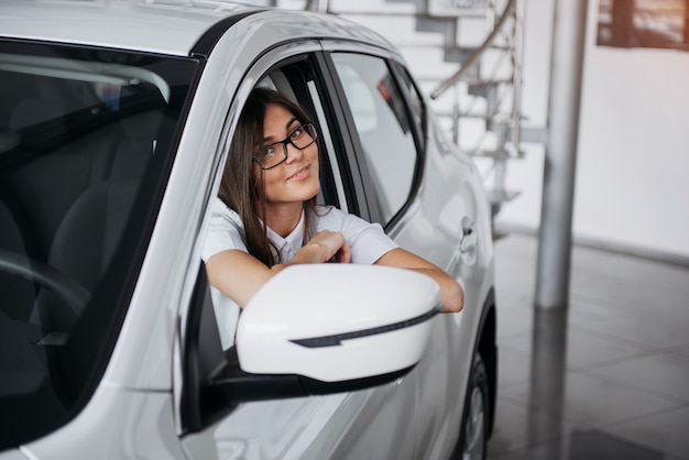 young Caucasian woman in a car