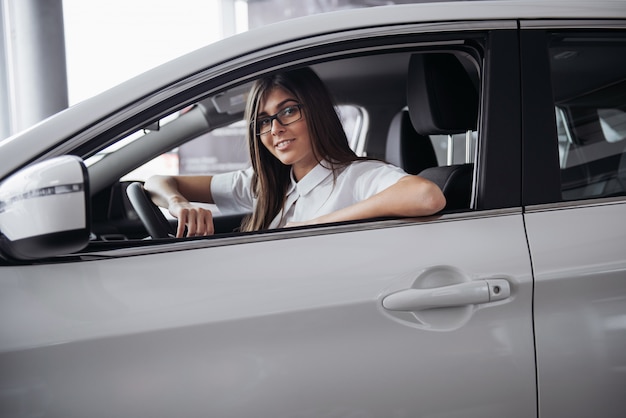 young Caucasian woman in a car