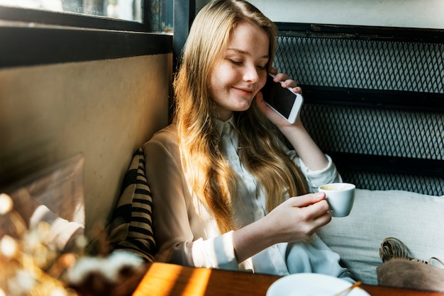 Young caucasian woman at a coffee shop