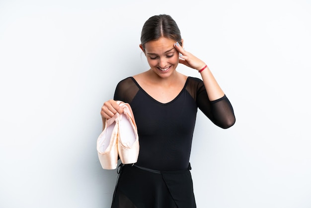 Young caucasian woman dancing ballet isolated on white background laughing