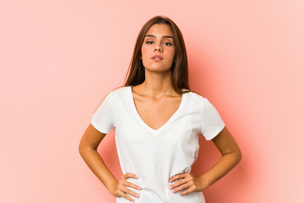 Young caucasian woman doing beauty poses isolated