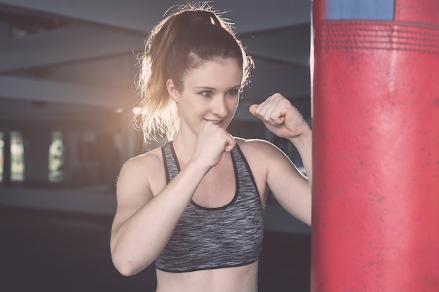 Young caucasian woman doing exercise