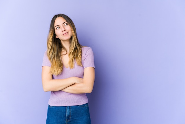 Young caucasian woman dreaming of achieving goals and purposes