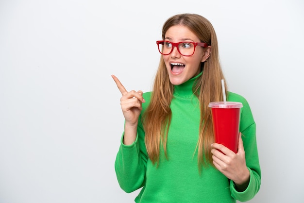 Young caucasian woman drinking soda isolated on white background intending to realizes the solution while lifting a finger up