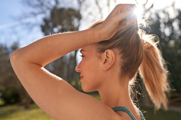 Young caucasian woman gets ready to conquer the outdoors with her running routine