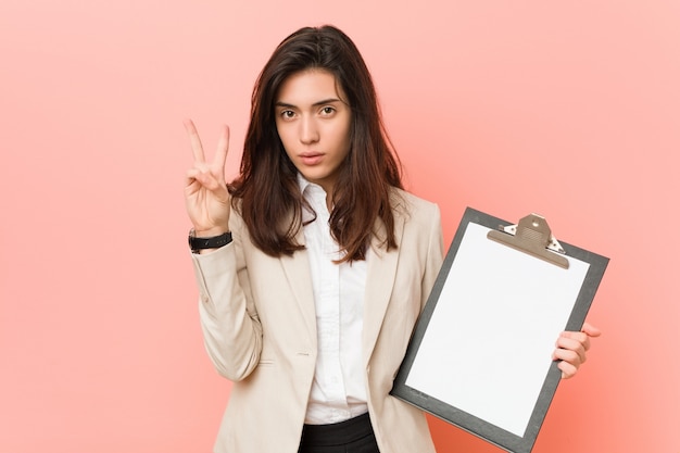 Young caucasian woman holding a clipboard