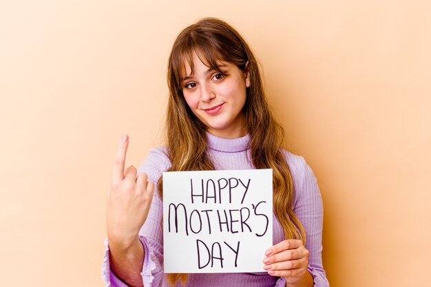 Young caucasian woman holding a Happy mothers day placard