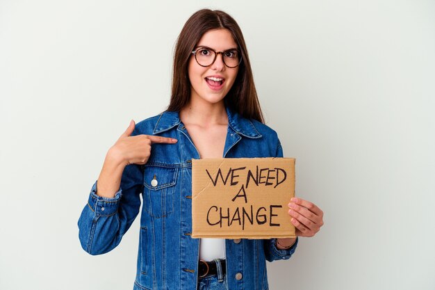 Photo young caucasian woman holding protect our planet placard isolated showing number two with fingers.