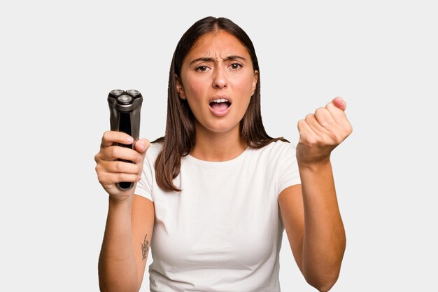 Young caucasian woman holding a razor isolated